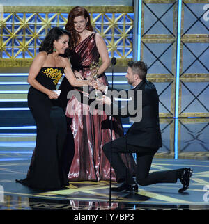 Actor Julia Louis-Dreyfus accepts the award for Outstanding Lead Actress in a Comedy Series for 'Veep' from actor Debra Messing and TV personality Chris Hardwick onstage during the 69th Annual Primetime Emmy Awards at Microsoft Theater on September 17, 2017 in Los Angeles, California.  Photo by Jim Ruymen/UPI Stock Photo