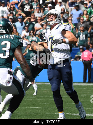 A Super Bowl Champion badge is seen on the chest of Philadelphia Eagles  defensive end Chris Long (56) during the first quarter of an NFL football  game against the Atlanta Falcons at