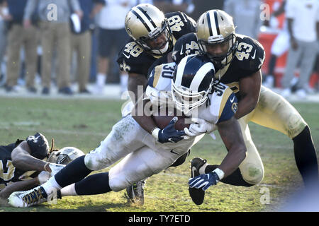 Los Angeles Rams Todd Gurley II is tackled by Saints safeties Marcus Williams (43) and Vonn Bell (48) in Los Angeles, November 26, 2017.  Photo by Jon SooHoo/UPI Stock Photo