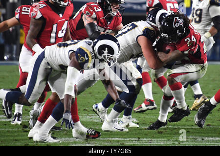 Los Angeles Rams' Morgan Fox (left) and Arizona Cardinals' D.J. Humphries  during the International Series NFL match at Twickenham, London Stock Photo  - Alamy