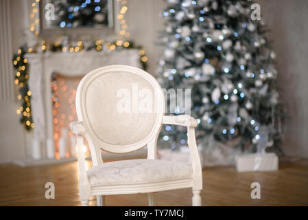 Classic Christmas decorated interior room with New year tree. Christmas tree  with silver decorations and gift box. Modern white classical style interi  Stock Photo - Alamy