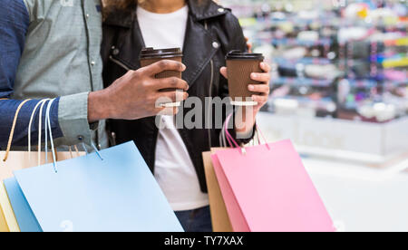 Young african american couple with a lot of colourful bags Stock Photo