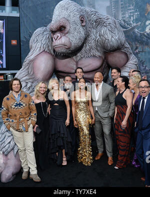 Cast members from left Jake Lacy , Marley Shelton, Malin Akerman, Jeffrey Dean Morgan, Jason Liles, Naomie Harris, Dwayne Johnson and Joe Manganiello attend the premiere of the sci-fi motion picture 'Rampage' at the Microsoft Theater in downtown Los Angeles on April 4, 2018. Storyline: The film follows a primatologist who must team-up with George, an albino gorilla who turns into a raging creature of enormous size following a rogue experiment, in order to stop an invasion of monsters.  Photo by Jim Ruymen/UPI Stock Photo