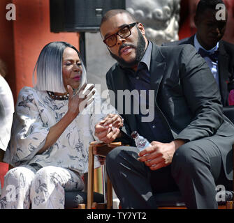 Director, screenwriter and actor Tyler Perry (R) and screen legend Cicely Tyson attend the hand and footprint ceremony honoring Tyson at the TCL Chinese Theatre in Hollywood during the 9th annual TCM Classic Film Festival on April 27, 2018. Photo by Chris Chew/UPI Stock Photo