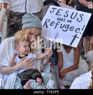 A coalition of advocacy groups protest outside the Metropolitan Detention Center as part of the nationwide 'Families Belong Together' march to decry the Trump administration's policy involving the separation of children from their parents and detention of families seeking asylum at the Mexico border in Los Angeles on June 30, 2018. The Los Angeles march was one of seven hundred held across the United States.  Photo by Jim Ruymen/UPI Stock Photo