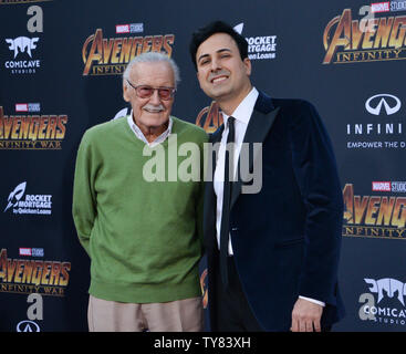 Marvel's Stan Lee (L) and Keya Morgan attend the April premiere of 'Avengers: Infinity War' in Los Angeles. Morgan, who until recently was managing Lee's affairs is currently under investigation for elder abuse. In a related case, Morgan's attorney entered a not guilty plea  Monday on behalf of his client, who is charged with calling 911 to report that authorities conducting a welfare check on the 95-year-old Lee were burglars.    File Photo by Jim Ruymen/UPI Stock Photo