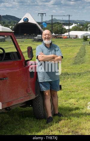 Glastonbury, UK. Saturday, 22 June, 2019. Michael Eavis poses for photos in front of the Pyramid Stage ahead of the opening of the 2019 Glastonbury Festival. Photo: Roger Garfield/Alamy Live News Stock Photo