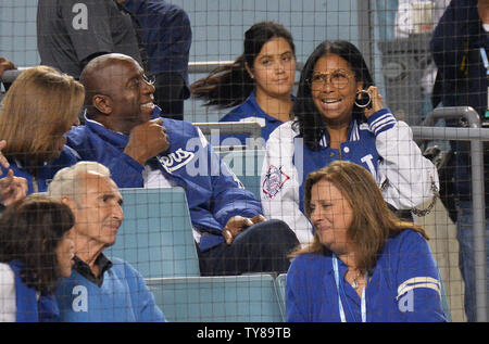 Earvin 'Magic' Johnson and his wife Earlitha 'Cookie' Kelly watch the Los Angeles Dodgers defeat the Atlanta Braves 3-0 in  game two of the National League Division Series at Dodger Stadium in Los Angeles on October 5, 2018.     Photo by Jim Ruymen/UPI Stock Photo