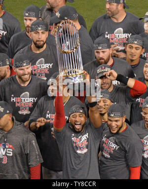 Boston Red Sox Mookie Betts holds up the Commissioner's Trophy as the Sox  celebrate after beating the Los Angeles Dodgers in game 5 of the MLB 2018 World  Series at Dodger Stadium
