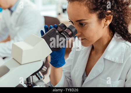 Face of a smart young female biologist Stock Photo