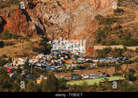 Pile of discarded cars stored on a rocky hillside in China Stock Photo