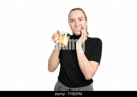 Young woman is cold sensitive when drinking cold drinks Stock Photo