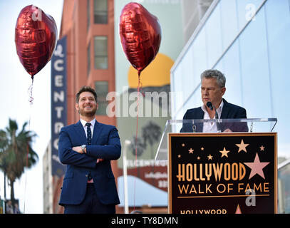 Composer David Foster (R) speaks at the star unveiling ceremony honoring Michael Buble (L) with the 2,650th star on the Hollywood Walk of Fame in Los Angeles, California on November 16, 2018. Photo by Chris Chew/UPI Stock Photo