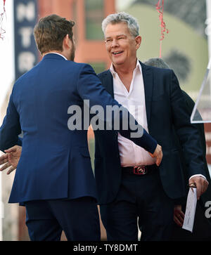 Composer David Foster (R) hugs Michael Buble at the star unveiling ceremony honoring Buble with the 2,650th star on the Hollywood Walk of Fame in Los Angeles, California on November 16, 2018. Photo by Chris Chew/UPI Stock Photo