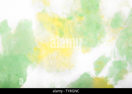 Light yellow and light green abstract watercolor dye art background Stock Photo