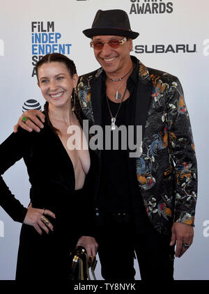 Ice Mrozek (R) and guest attend the 34th annual Film Independent Spirit ...