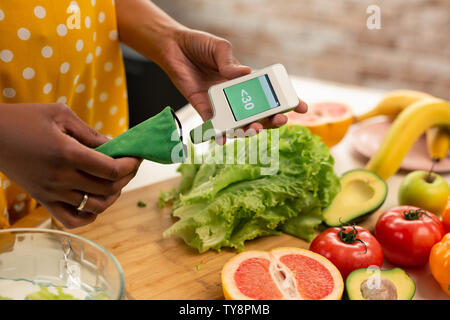 Small nitrate meter in hands of a beautiful woman. Stock Photo