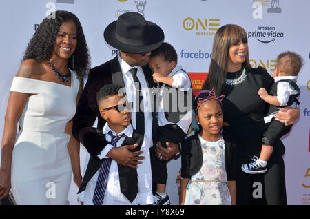 Ne-Yo (3rd from left) and his family arrive for the 50th annual NAACP Image Awards at the Dolby Theatre in the Hollywood section of Los Angeles on March 30, 2019. The NAACP Image Awards celebrates the accomplishments of people of color in the fields of television, music, literature and film and also honors individuals or groups who promote social justice through creative endeavors. Photo by Jim Ruymen/UPI Stock Photo