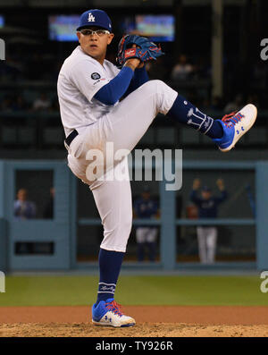 Los Angeles Dodgers' relief pitcher Julio Urias winds up to deliver in the eighth inning against the Philadelphia Phillies at Dodger Stadium in Los Angeles on June 1, 2019. Urias gave up a two-run blast to Bryce Harper to knot the score 3-3. After giving up two home runs in his first 30 1/3 innings, Urias has given up three in his last two outings. The left-hander has allowed four runs on five hits in five innings since coming off administrative leave following his arrest on suspicion of domestic battery May 13.The Dodgers won 4-3 with a walk-off by rookie Will Smith, his first career home run Stock Photo