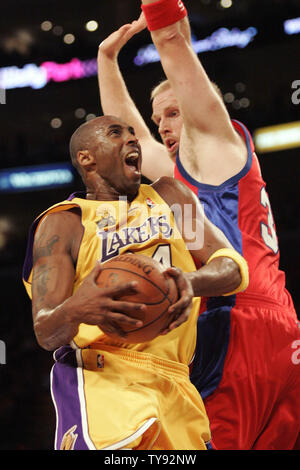 Los Angeles Lakers guard Kobe Bryant goes up for a basket over Los Angeles Clippers center Chris Kaman, right, in the first half of a NBA basketball game in Los Angles on October 27, 2009.    UPI/Lori Shepler Stock Photo