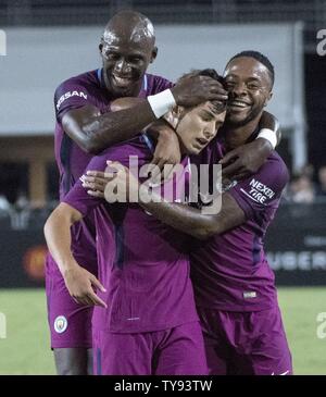 Manchester City's Eliaquim Mangala and Manchester City's fRaheem Sterling celebrates with Manchester City's midfielder Brahim Diaz's goal in the second half during their International's Champions Cup match at the Los Angeles Memorial Coliseum in Los Angeles on July 26, 2017.  Photo by Michael Goulding/UPI Stock Photo