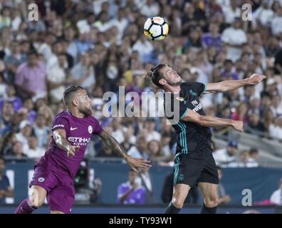 Real Madrid's forward Gareth Bale (11) and Manchester City's defender Nicol‡s Otamendi (30) battle near Manchester City's goal in the first half during their International's Champions Cup match at the Los Angeles Memorial Coliseum in Los Angeles on July 26, 2017.  Photo by Michael Goulding/UPI Stock Photo