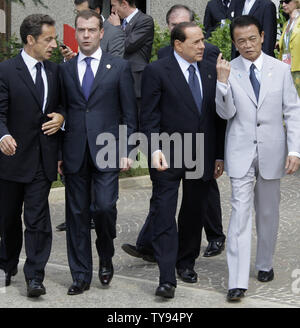 (L-R) French President Nicolas Sarkozy, Russian President Dmitry Medvedev, Italian Prime Minister Silvio Berlusconi and Japanese Prime Minister Taro Aso walk prior to a group photo of G8 leaders at the G8 summit in L'Aquila, Italy  on July 8, 2009. (UPI Photo/Anatoli Zhdanov) Stock Photo