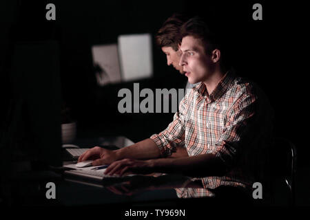 two employees working late Stock Photo
