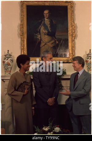Mrs. Michael Manley, Prime Minister Michael Manley and Jimmy Carter during an Oval Office meeting. Stock Photo