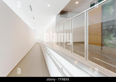 Modern office corridor with wheelchair pathway Stock Photo