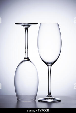Empty Glass of red wine, two pieces. One's upside down. Stock Photo