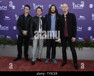 (L-R) Musicians Chris Thompson, Mike Eli, James Young, and Jon Jones of Eli Young Band arrive at the 48th annual Academy of Country Music Awards at the MGM Hotel in Las Vegas, Nevada on April 7, 2013. UPI/David Becker Stock Photo