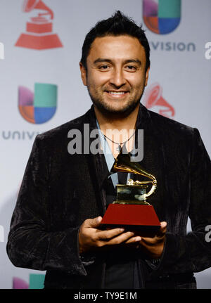 Singer Alex Campos hold the award he won for Best Spanish Christian Album for 'Regreso A Ti,' backstage at the Latin Grammy Awards at the Mandalay Bay Events Center in Las Vegas, Nevada on November 21, 2013.    UPI/Jim Ruymen Stock Photo