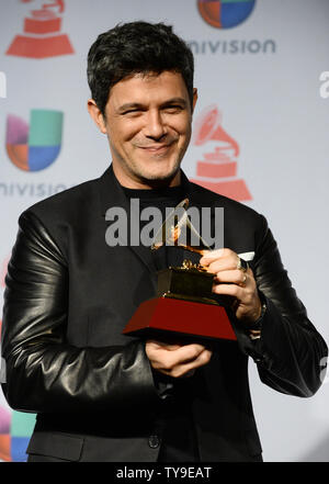 Recording artist Alejandro Sanz holds the award he won for Best Contemporary Pop Vocal Album for 'La Mœsica No Se Toca', backstage at the Latin Grammy Awards at the Mandalay Bay Events Center in Las Vegas, Nevada on November 21, 2013.    UPI/Jim Ruymen Stock Photo