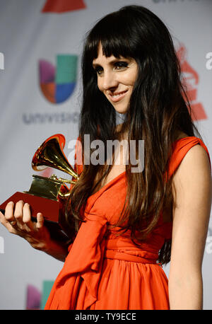 Singer Mala Rodriguez holds the award she won for Best Urban Music Album 'Bruja', backstage at the Latin Grammy Awards at the Mandalay Bay Events Center in Las Vegas, Nevada on November 21, 2013.    UPI/Jim Ruymen Stock Photo