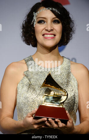 Recording artist Gaby Moreno holds the award she won for Best New
