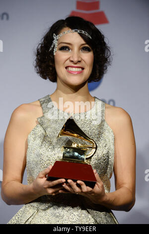 Recording artist Gaby Moreno holds the award she won for Best New