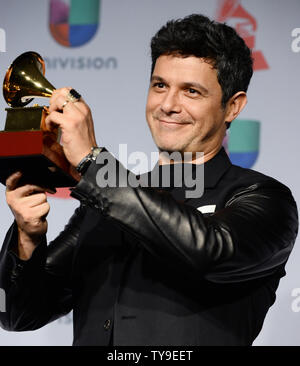 Recording artist Alejandro Sanz holds the award he won for Best Contemporary Pop Vocal Album for 'La MÏsica No Se Toca', backstage  at the Latin Grammy Awards at the Mandalay Bay Events Center in Las Vegas, Nevada on November 21, 2013. UPI/Jim Ruymen Stock Photo