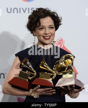 Natalia Lafourcade poses in the press room with the awards for best alternative music album, best alternative song, and record of the year for 'Hasta La Raiz??? during the 16th Annual Latin Grammy Awards at the MGM Grand Garden Arena in Las Vegas, Nevada on November 19, 2015.   Photo by Jim Ruymen/UPI Stock Photo