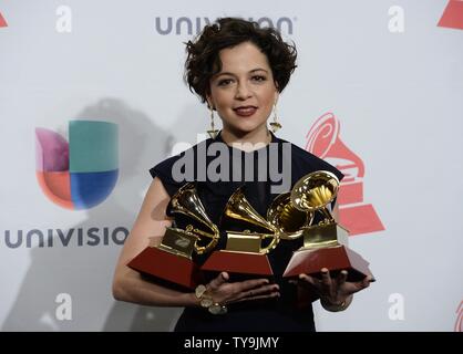 Natalia Lafourcade poses in the press room with the awards for best alternative music album, best alternative song, and record of the year for 'Hasta La Raiz??? during the 16th Annual Latin Grammy Awards at the MGM Grand Garden Arena in Las Vegas, Nevada on November 19, 2015.   Photo by Jim Ruymen/UPI Stock Photo