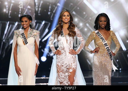 Top 3 contestants Miss Georgia USA, Emanii Davis, Miss Hawaii USA, Chelsea Hardin and Miss District of Columbia USA, Deshauna Barber onstage during the Miss USA Pageant competition at T-Mobile Arena in Las Vegas, Nevada on June 5, 2016. Photo by James Atoa/UPI Stock Photo