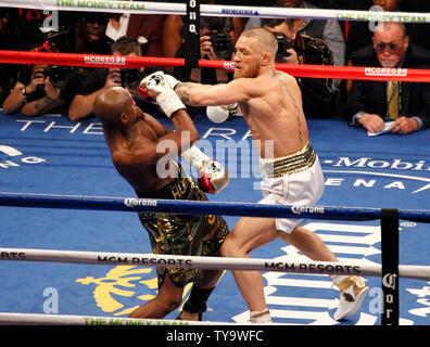 Floyd Mayweather, left, and Conor McGregor exchange harsh words during ...