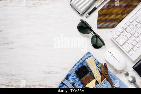 Flat lay accessories tools and clothing for worker on rusty white wooden with copy space. Blank space top view for labor or labour day, worker's day, Stock Photo