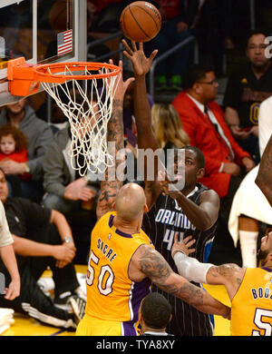 Orlando Magic forward Andrew Nicholson (44) shoots over Los Angeles Laker Robert Sacre (50) during the first half of their NBA game at Staples Center in Los Angeles, January 9, 2015. The Lakers beat the Magic 101-84.   UPI/Jon SooHoo Stock Photo