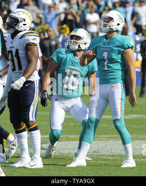 Miami Dolphins kicker Cody Parkey (1) winds up for a kick with punter ...