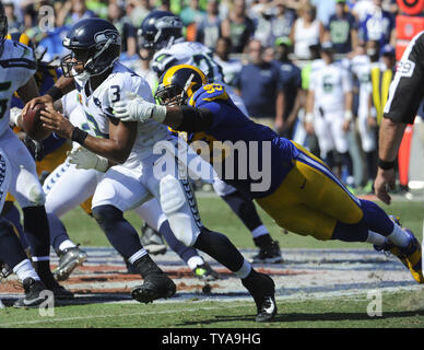 Los Angeles Rams defensive tackle Aaron Donald tackles Seattle Seahawks quarterback Russell Wilson in the first half at the Memorial Coliseum in Los Angeles, California on October 8, 2017.  Photo by Lori Shepler/UPI Stock Photo