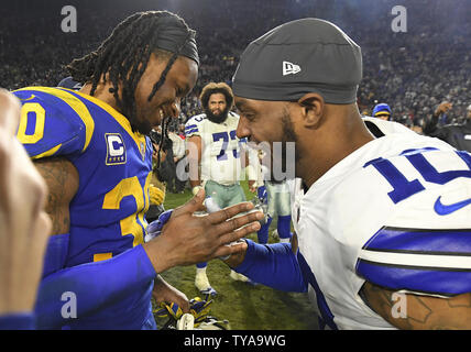 After the game Los Angeles Rams Todd Gurley (30) is congratulated by Dallas Cowboys Tavon Austin (10) who is a former Ram after the Rams defeated the Dallas Cowboy in a divisional-round playoff game at The Coliseum in Los Angeles, California on January 12, 2019.      Photo by John McCoy/UPI Stock Photo
