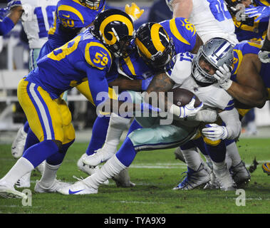 Dallas Cowboys running back Ezekiel Elliott is stopped by the Los Angeles Rams in the first half of their divisional-round playoff game at The Coliseum in Los Angeles, California on January 12, 2019. Photo by Lori Shepler/UPI Stock Photo