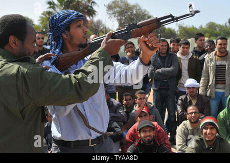 Rebel recruits listen during their first day of military training at a rebel militia center on March 3, 2011 in Benghazi, Libya. Supporters of the Libyan opposition, which controls Benghazi and most of eastern Libya, have been eager to join militia groups, which have been fighting the forces of President Muammar Gaddafi to the west near the capitol Tripoli.   UPI/Mohamaad Hosam Stock Photo