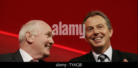 British Secretary of State for Defence Dr. John Reid jokes with Tony Blair as the 2005 Labour party conference comes to an end in Brighton,England September 29 2005. (UPI Photo/Hugo Philpott) Stock Photo